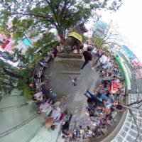 The bronze statue of the dog Hachiko in front of Shibuya Station in Tokyo pops out from the crowd in this Sept. 25 image. | YOSHIAKI MIURA