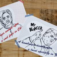 Campaign posters of Mr. and Mrs. burgers featuring U.S. presidential candidates Hillary Clinton and Donald Trump are displayed at J.S. Burgers Cafe in Tokyo on Oct. 7. | REUTERS