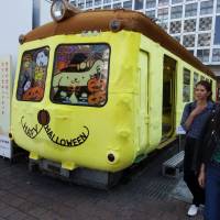Aogaeru (green frog), an iconic train car that sits in front of JR Shibuya Station near the famous Hachiko statue, is seen Thursday dressed up to look like Sanrio’s popular character Pom Pom Purin in an effort to prevent vandalism on Halloween night. Shibuya's tourism car gets Sanrio makeover to ward off Halloween chaos