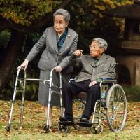 Prince Mikasa and his wife Princess Yuriko talk at their residence in Tokyo in this Nov. 16, 2015, file photo released by the Imperial Household Agency. | AP
