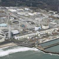 The Fukushima No. 1 nuclear plant, operated by Tokyo Electric Power Company Holdings Inc., is seen from the air in March. | KYODO