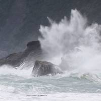 High waves brought by Typhoon Chaba hit a beach on Amami Oshima Island in Okinawa Prefecture on Monday. | KYODO