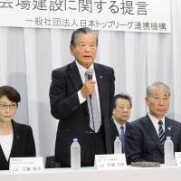 Saburo Kawabuchi, head of the Alliance of Japan Top Leagues, speaks at a news conference Wednesday in Tokyo about the construction of the Ariake Arena volleyball venue for the Tokyo 2020 Olympics. | KYODO