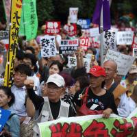 Loud and proud: Protesters take part in a rally against the security bills in Tokyo in 2015. | BLOOMBERG
