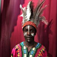 Out of Africa: Abdou Baye Fall, seen here decked out in Zulu style while working in Iwate this month. Baye Fall travels the country teaching children about the cultures of his homeland of Senegal. | COURTESY OF ABDOU BAYE FALL