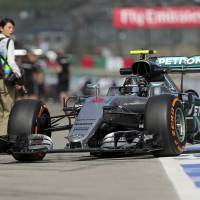 Mercedes driver Nico Rosberg steers his car back to his team garage during Friday’s first practice session for the Japanese Grand Prix at Suzuka Circuit in Suzuka, Mie Prefecture. Rosberg posts fastest time during Japanese Grand Prix practice sessions