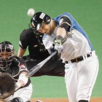 The Fighters\' Brandon Laird bashes a three-run home run in the first inning against the Hawks on Friday at Sapporo Dome. Hokkaido Nippon Ham defeated Fukuoka SoftBank 4-1 in Game 3 of the Pacific League Climax Series Final Stage. | KYODO