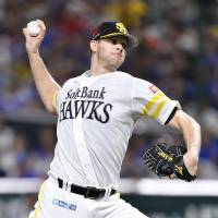 Hawks hurler Rick van den Hurk pitches in Game 2 of the Pacific League Climax Series First Stage against the Marines at Yafuoku Dome on Sunday. Fukuoka SoftBank defeated Chiba Lotte 4-1 to win the best-of-three series. | KYODO