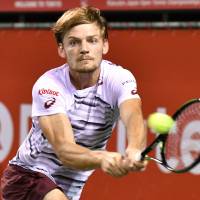 David Goffin plays a shot from Marin Cilic in their semifinal match at the Japan Open on Saturday at Ariake Colosseum. Goffin won 7-5, 6-4. Goffin, Kyrgios roll into Japan Open final