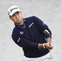 Hideki Matsuyama takes an approach shot on the second hole during the second round of the  World Golf Championships-HSBC Champions in Shanghai on Friday. Matsuyama shot a 7-under-par 65. | KYODO