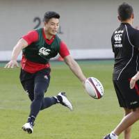 Akihito Yamada (left) takes part in a training session with his Japan teammates on Monday. | KYODO