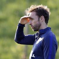 England interim manager Gareth Southgate shields his eyes from the sun during a practice session on Tuesday. England's Southgate begins trial period against easiest of foes, Malta