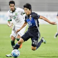 Japan\'s Yuto Iwasaki dribbles the ball during the Asian Under-19 Championship final against Saudi Arabia on Sunday. | KYODO