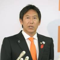 Sports Agency Commissioner Daichi Suzuki speaks to reporters on Monday. | KYODO