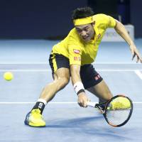 Kei Nishikori plays a shot during his Swiss Indoors final match against Marin Cilic in Basel, Switzerland, on Sunday. | REUTERS