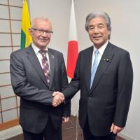 Lithuania\'s Vice Minister of Foreign Affairs Neris Germanas (left) joins Japan-Lithuania Parliamentary Friendship League Chairman Hirofumi Nakasone, during a reception celebrating the 25th anniversary of the re-establishment of diplomatic relations between Lithuania and Japan at the Lithuanian Embassy in Tokyo on Oct. 17. | YOSHIAKI MIURA
