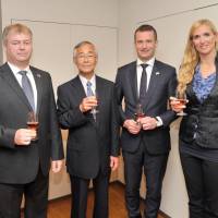 From left, Charge d\'affaires of Hungary Attila Erdos joins Chairman of the Japan-Hungary Friendship Association Shinichi Nabekura; Hungary\'s Ambassador-designate Norbert Palanovics; and Hungary\'s State Secretary for Sports Tunde Szabo during a National Day reception at the embassy in Tokyo on Oct. 21. | YOSHIAKI MIURA