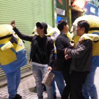 Chance encounters — from the Shibuya scramble, Oct. 29.  | MARK THOMPSON