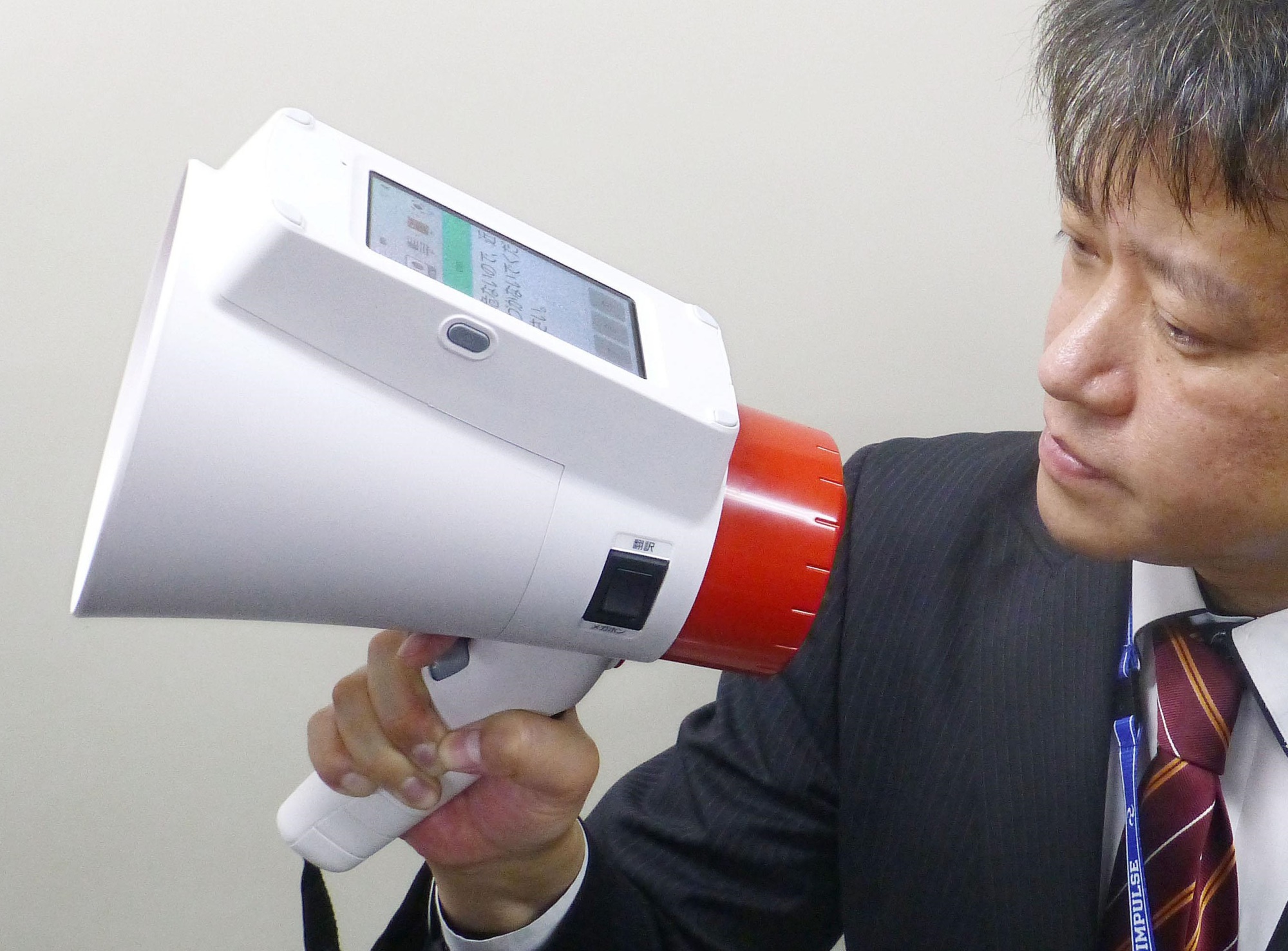 Panasonic Corp.'s new megaphone features automatic translation of Japanese into English, Chinese and Korean. | KYODO