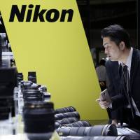 Nikon Corp. is reportedly considering slashing some 1,000 domestic jobs as part of efforts to restructure its chip and camera business. | BLOOMBERG