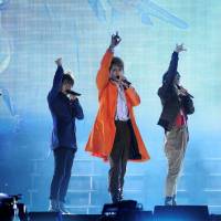 Members of the all-male pop group SMAP perform at a September 2011 concert in Beijing.  | | CHINA DAILY / VIA REUTERS