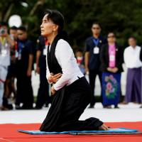 Myanmar State Counselor Aung San Suu Kyi attends an event marking the 69th anniversary of Martyrs\' Day at the Martyrs\' Mausoleum dedicated to fallen independence heroes in Yangon in July. | REUTERS
