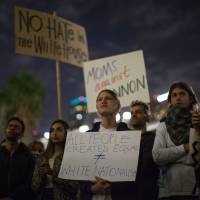People outside Los Angeles City Hall in November protest Donald Trump\'s appointment of former Breitbart News head Steve Bannon, a white nationalist alt-right media mogul, to be chief strategist of the White House. | AFP-JIJI