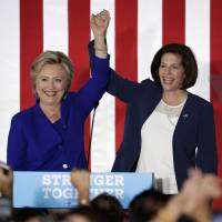Democratic presidential candidate Hillary Clinton (left) and Democratic Senate candidate Catherine Cortez Masto take the stage at a rally Wednesday in Las Vegas. | AP
