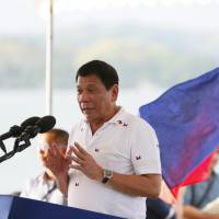 Philippine President Rodrigo Duterte addresses a crowd during his visit to Sual township, Pangasinan province in northern Philippines, on Nov. 2. | AP