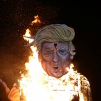 An effigy of Republican U.S. presidential candidate Donald Trump is burned as part of Bonfire Night celebrations in Edenbridge, England, late Saturday. | REUTERS