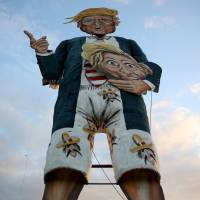 An effigy of Republican U.S. presidential candidate Donald Trump stands waiting to be burned as part of bonfire night celebrations in Edenbridge, England, on Saturday. | REUTERS