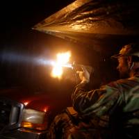 Members of the Oath Keepers and general public return fire during a simulated attack as they take part in a tactical training session in northern Idaho on Oct. 1. | REUTERS