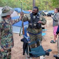Members of the Three Percent Security Force militia gather for a field training exercise in Jackson, Georgia, on Oct. 29. | REUTERS