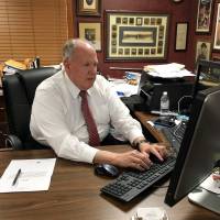 Craig Dunn, Republican party chairman for Howard County, Indiana, works at his desk in Kokomo Nov. 1. | REUTERS