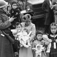 Shigeho Kitamoto and her four children are forcibly relocated along with others from Bainbridge Island, Washington, in March 1942 as part of the U.S. government\'s internment of people with Japanese ancestry. | AP