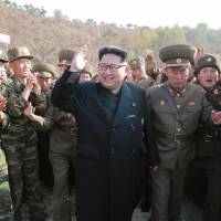 North Korean leader Kim Jong Un inspects a special operations battalion in this undated photo released Friday. | REUTERS