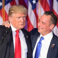 Chairman of the Republican National Committee (RNC) Reince Priebus embraces President-elect Donald Trump during election night at the New York Hilton Midtown in New York Wednesday. CNN is reporting Sunday that Trump has selected Priebus to be his White House chief of staff. | AFP-JIJI