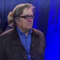 Trump campaign chairman Steve Bannon watches Nov. 5 as Republican presidential nominee Donald Trump speaks during a rally at the Reno-Sparks Convention Center in Reno, Nevada. Trump made the first top appointments of his new administration Sunday, naming Reince Priebus his White House chief of staff and Bannon as his chief strategist and senior counselor. | AFP-JIJI