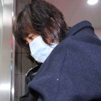 Choi Soon-sil, the confidante of South Korean President Park Geun-hye at the center of a influence-peddling scandal, arrives for questioning at the Seoul prosecutor\'s office Tuesday. | REUTERS
