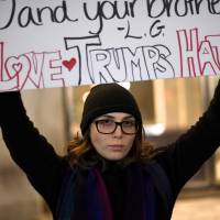 A woman protests the election of Republican Donald Trump as U.S. president in Philadelphia on Friday. | REUTERS