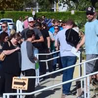People wait in line to vote in the U.S. presidential election at Santa Monica City Hall on Tuesday in Santa Monica, California. | AFP-JIJI