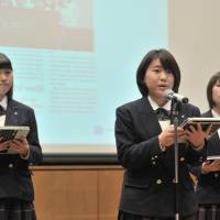 Masami Shibata, a student at Soka Senior High School, speaks after receiving the English Paper Champion Prize Sunday in Tokyo. | YOSHIAKI MIURA