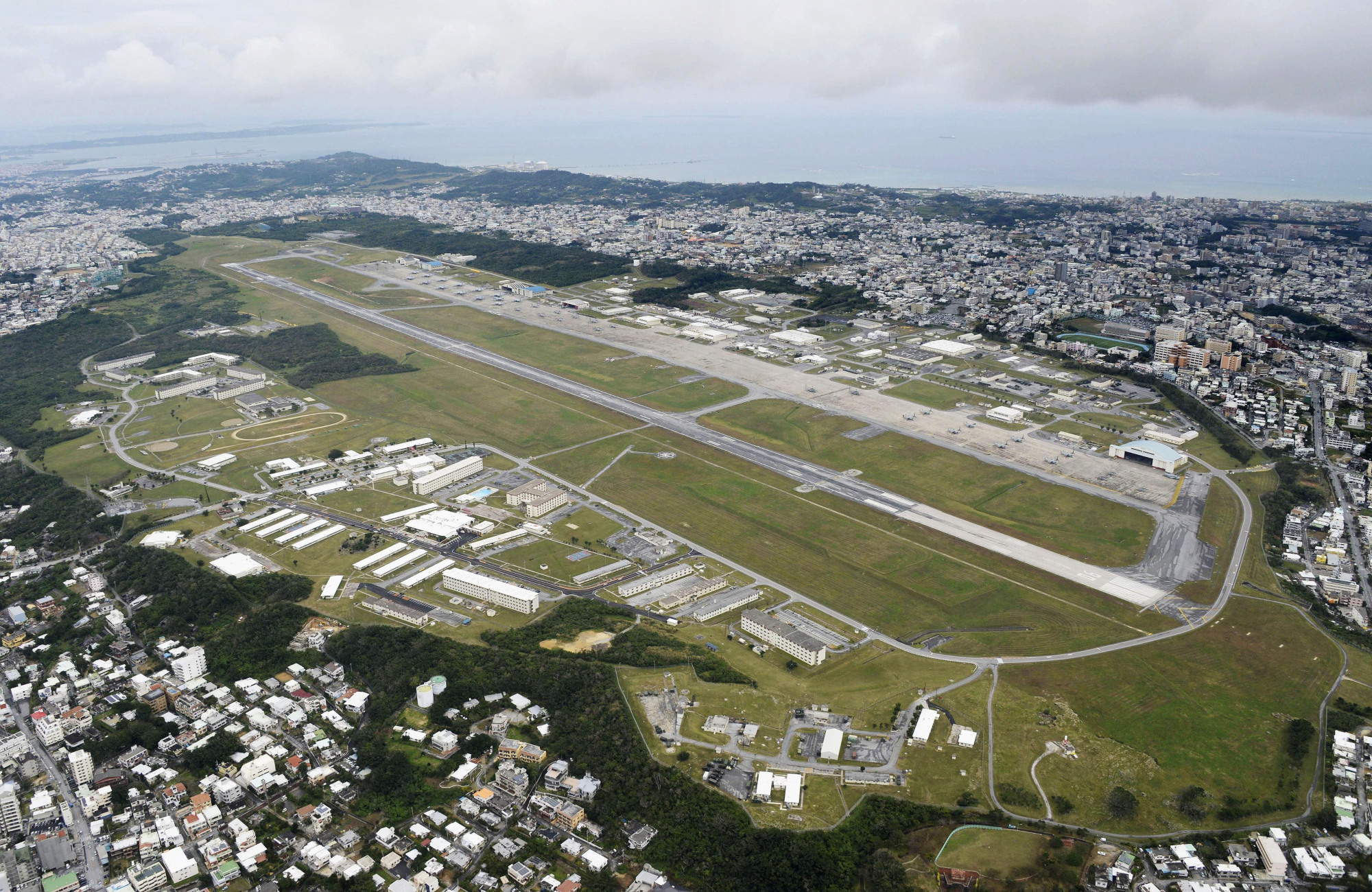 The U.S. Marine Corps Air Station Futenma sits in Ginowan, central Okinawa Prefecture. Locals against the base hope U.S. president-elect Donald Trump will abort controversial relocation plans. | KYODO