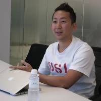 Eiji Araki, vice president of Gree Inc., is interviewed at his office in Tokyo on Nov. 11. | KAZUAKI NAGATA