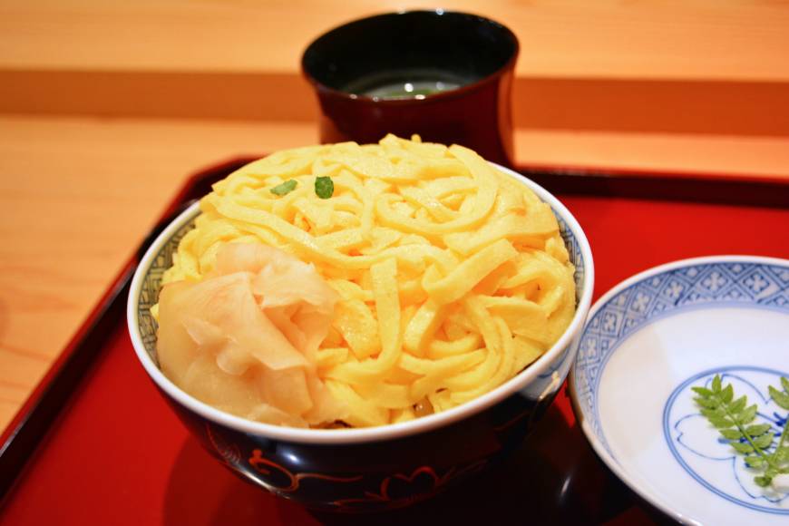 Yoshino Sushi Egg on top: Mushizushi is a bowl of steamed rice topped with bright yellow threads of sweetened omelet. | J.J. O'DONOGHUE