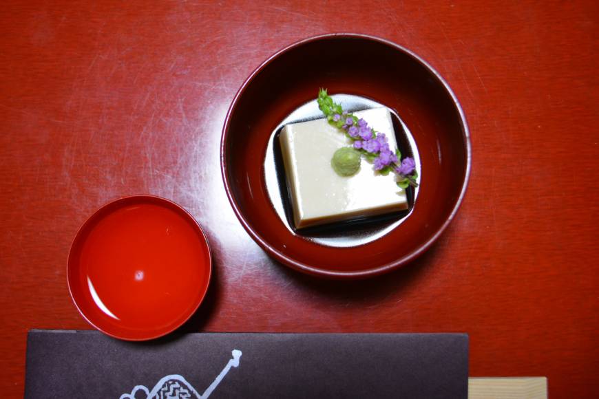 Ajiro Sharp and creamy: Ajiro's goma-dofu (sesame tofu) comes topped with a sprig of hana-sanshō (pepper flowers). | J.J. O'DONOGHUE