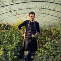 Green thumb: Belgian chef Gert De Mangeleer stands in the greenhouse that hosts many of the ingredients he uses in the meals served at Hertog Jan. | AP