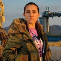 Angela Ortiz is pictured in April 2011 while on an emergency supplies delivery run to tsunami-hit Minamisanriku in Miyagi Prefecture. | COURTESY OF ANGELA ORTIZ