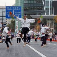 Dancers take to the air during a performance of Sendai Suzume Odori. | MARK THOMPSON