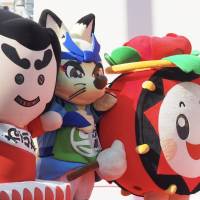 Among the visiting dignitaries at the opening ceremony of the Tohoku Rokkon Festival Parade were sundry mascots from Japan\'s northern region. | MARK THOMPSON